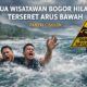 HANYA ILUSTRASI: Dua wisatawan terseret arus bawah saat bermain di Pantai Sunset, Cisolok, Kabupaten Sukabumi, Minggu (18/1/2026). Sumber Foto: Gambar dihasilkan Artificial Intelligence.